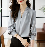 Stijlvolle V-hals damesblouses met trendy pofmouwen van ISHI