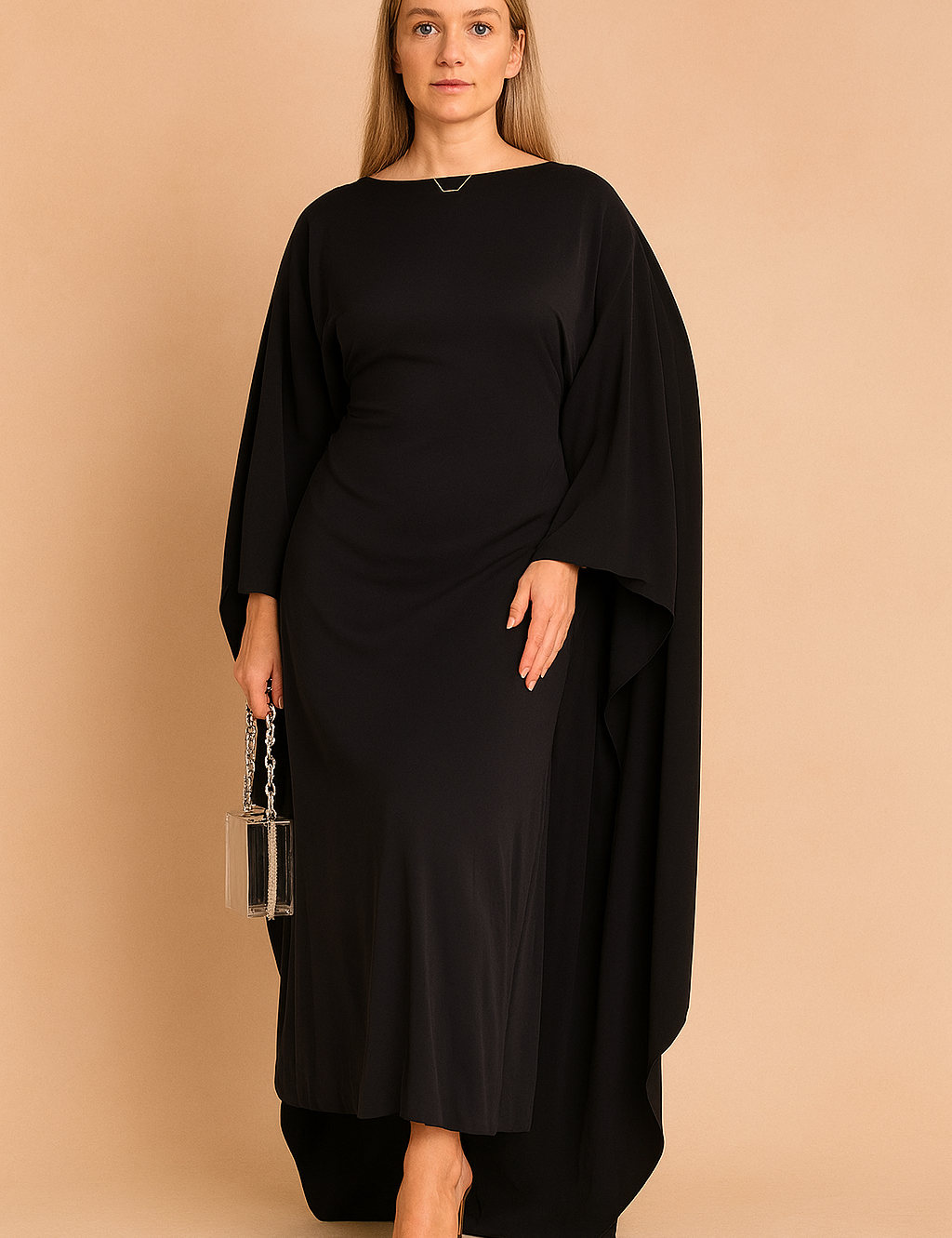 Maxi jurk in zwart met dramatische vleermuismouwen en aansluitende taille, perfect voor een avondfeest.