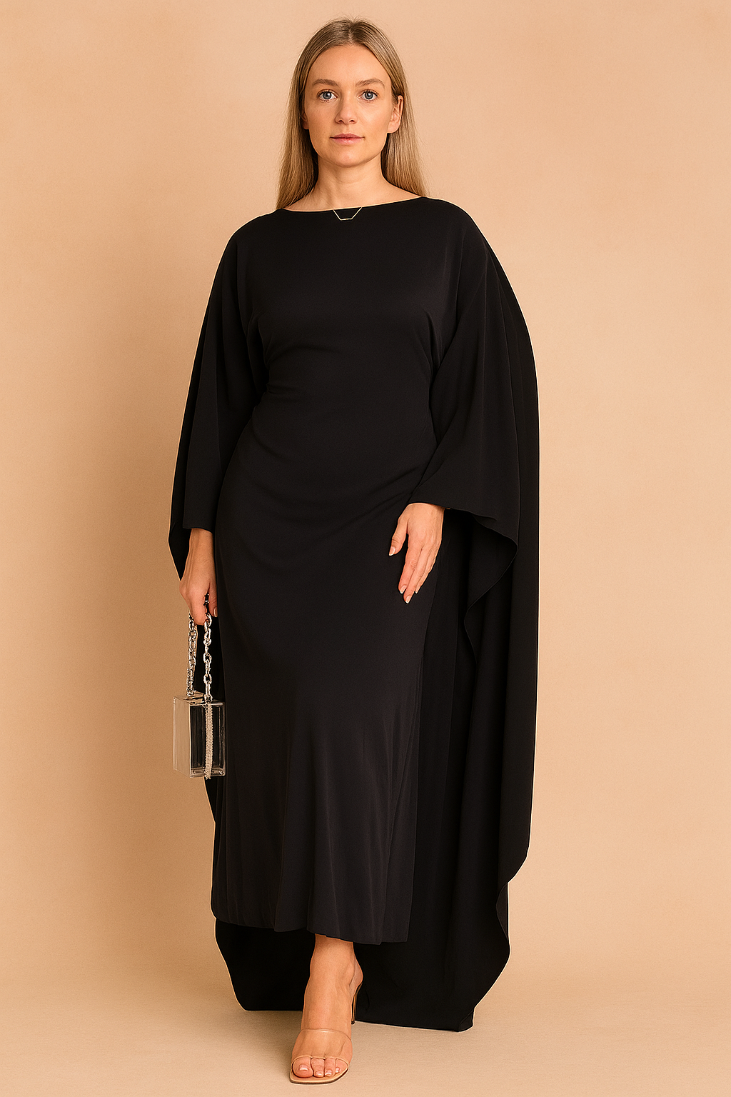 Maxi jurk in zwart met dramatische vleermuismouwen en aansluitende taille, perfect voor een avondfeest.
