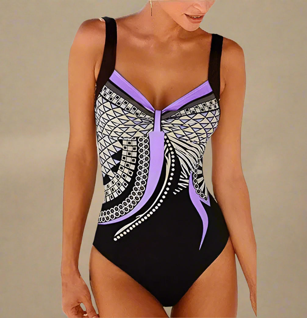 Zwart badpak met lila paarse geometrische print en twist voor een flatterende pasvorm