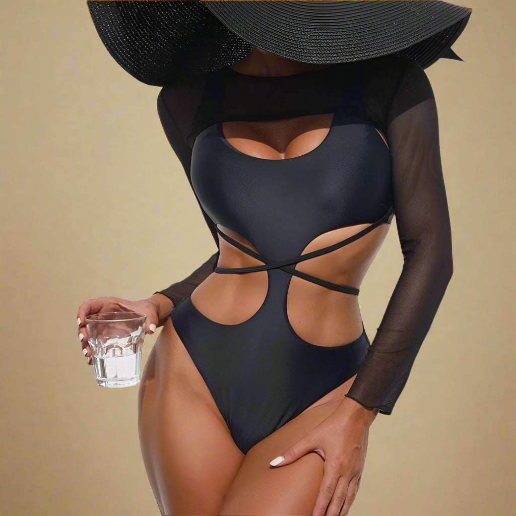 Zwart cut-out badpak met lange mesh mouwen en gekruiste bandjes in opvallend asymmetrisch ontwerp