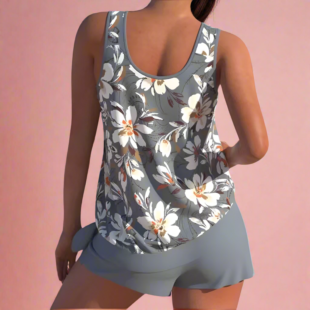 Donkergrijze dames pyjamaset met grote witte bloemenprint en mouwloos hemdje met bijpassende shorts.