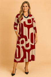 Midilange beige jurk met rood abstract patroon, lange mouwen en relaxte pasvorm voor dagelijks gebruik