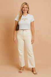 Wit cropped T-shirt van katoen met korte mouwen, ronde hals en opvallende MILANO-tekstprint in oranje met sierlogo.